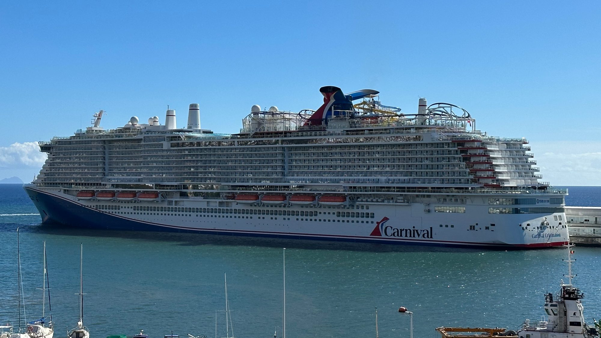 Carnival Celebration cruise ship docked in port on a sunny day